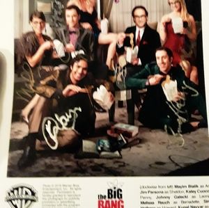 An autographed picture of the big bang theory crew